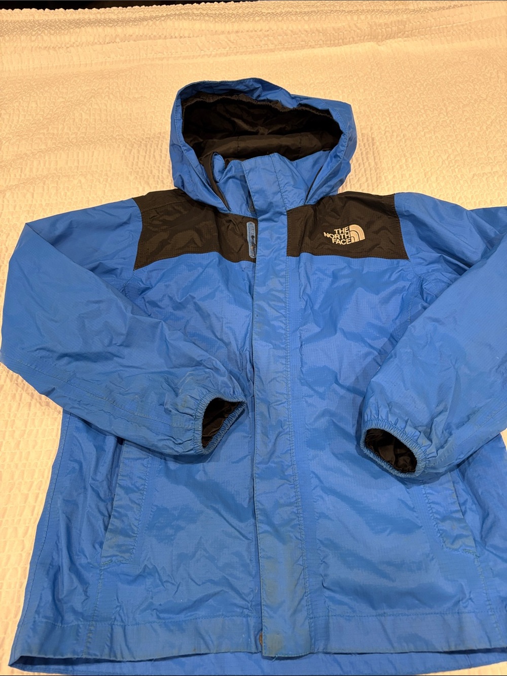 The North Face Blue and Black Hooded Kids Rain Jacket
Size M Boys